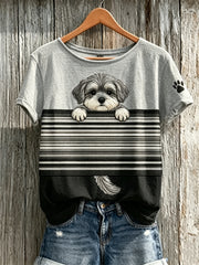 T-shirt à manches courtes pour femme, motif color-block avec un schnauzer qui fait coucou et des empreintes de patte
