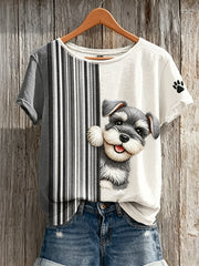 T-shirt à manches courtes pour femme, motif color-block avec un schnauzer qui fait coucou et des empreintes de patte